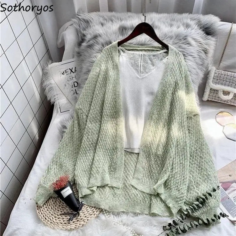 Lightweight cotton blend Breeze Whisper Cardigan in soft pastel color, perfect for spring layering.