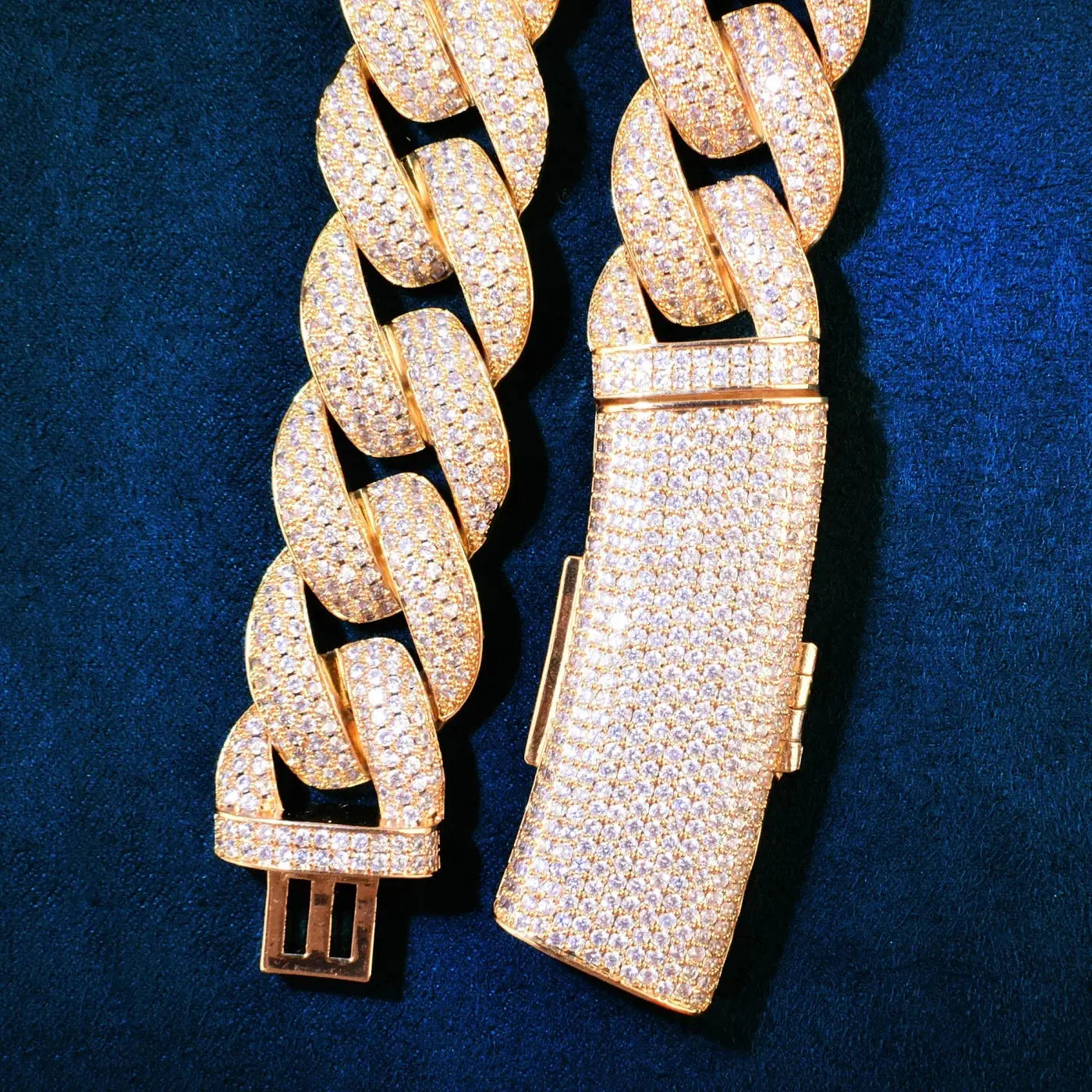 Detailed view of the heavy link design of the gold Cuban chain with sparkling zirconia.