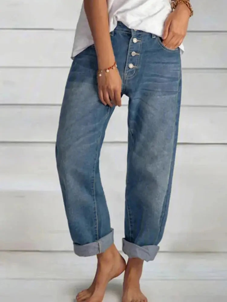 Model wearing Sunlit Mornings wide-leg jeans with a tucked-in blouse, highlighting versatile styling options.