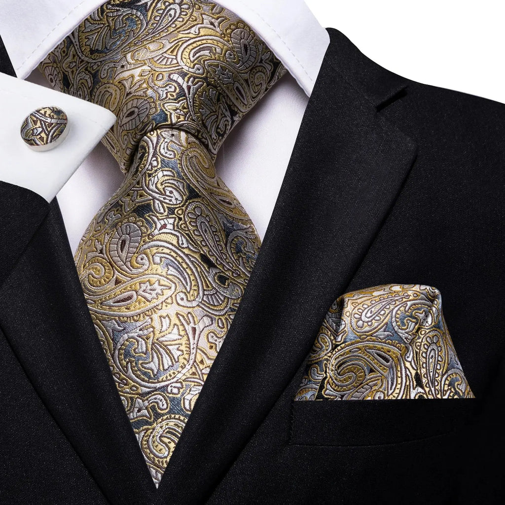 Matching cufflinks featuring a sophisticated design in silver.