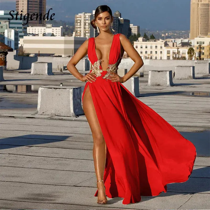 Evening dress with a high split and V-neckline, perfect for special occasions.