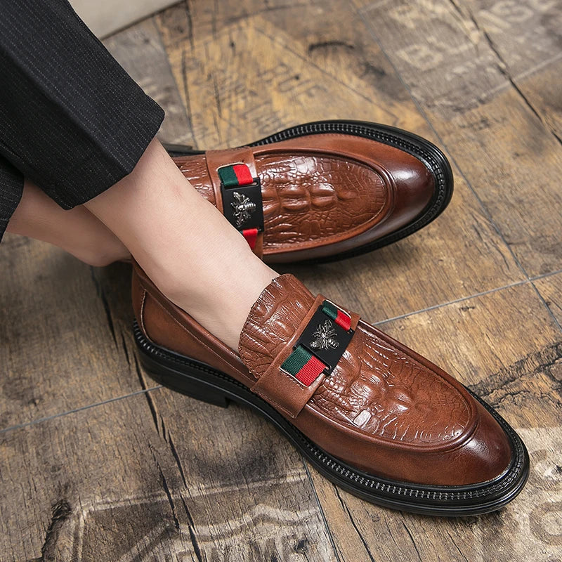 Wine colored crocodile texture loafers paired with tailored business suit