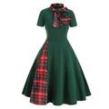 Detail shot of the bold red plaid pattern on the vintage midi dress.