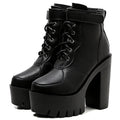 Modern black lace-up ankle boots with bold buckle hardware and durable construction
