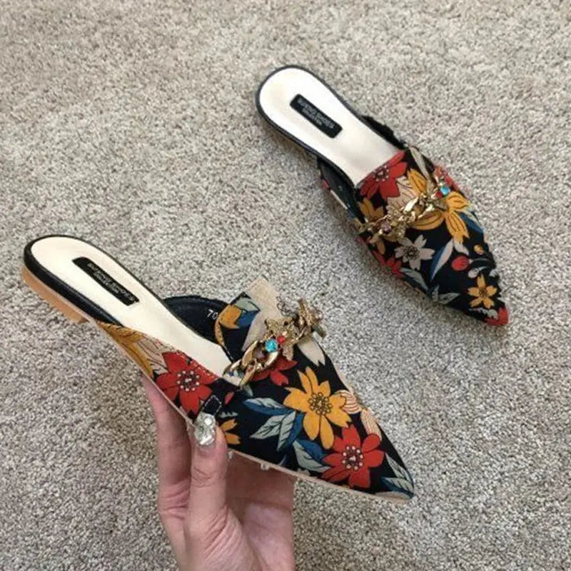 Top-down view of Floral Whisper Slippers highlighting the luxurious silk upper and unique design.