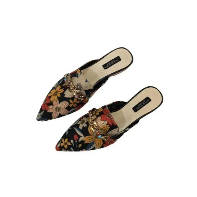 Lifestyle shot of a woman wearing Floral Whisper Slippers, perfect for indoor relaxation.