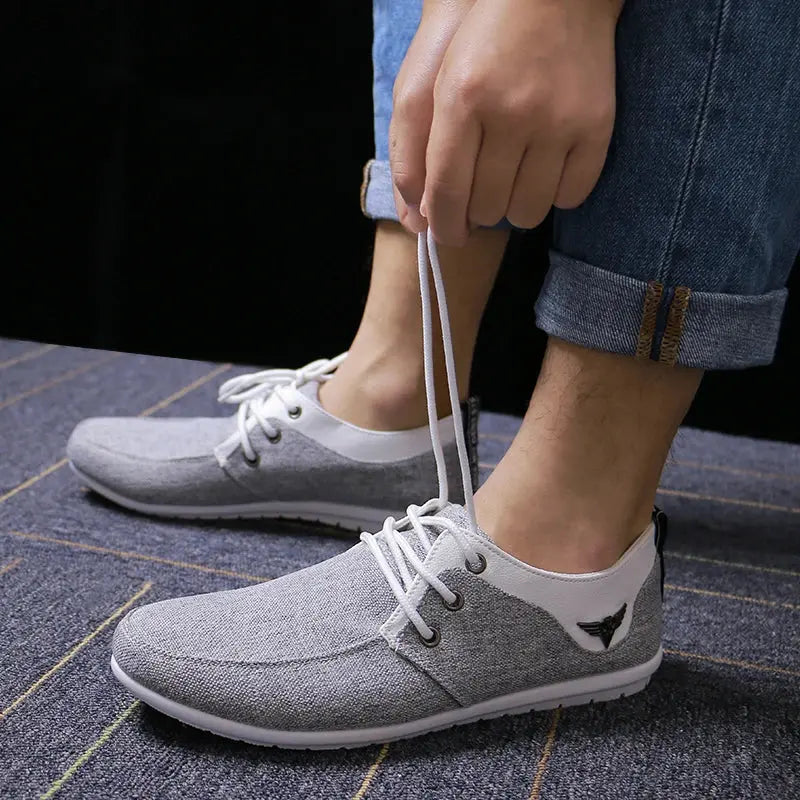 Side view of lightweight Breathe Easy Canvas Sneakers with durable rubber outsoles.