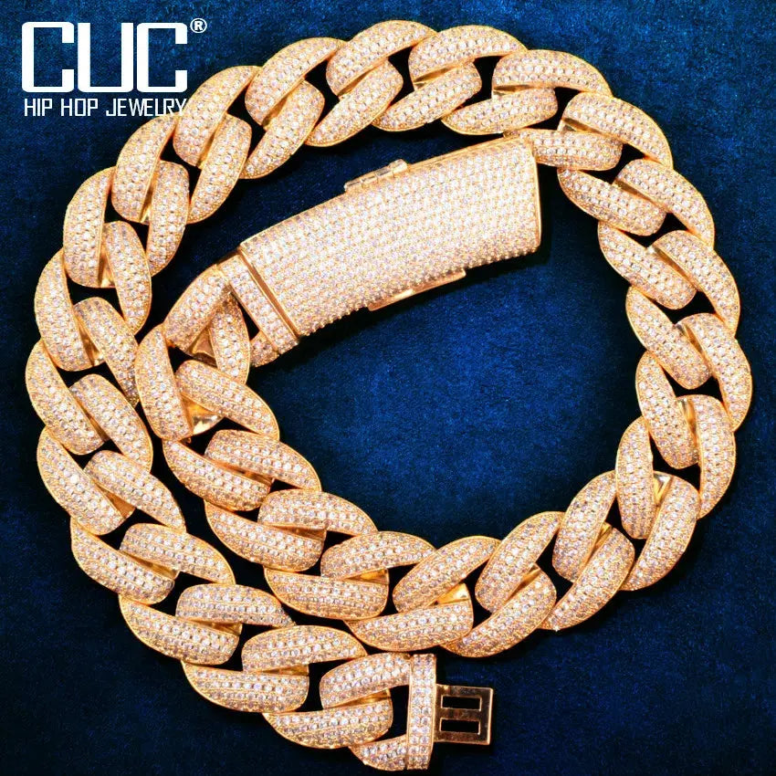 Gold luxe Cuban chain necklace with heavy link design and cubic zirconia accents.