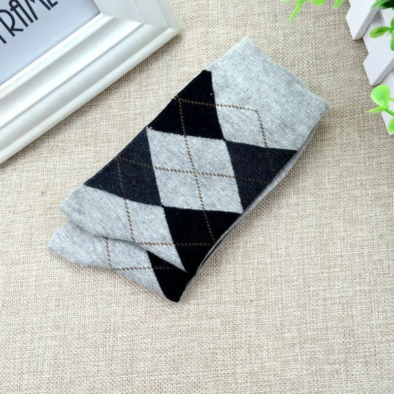 Elegant patterned socks in dark brown, perfect for professional attire.