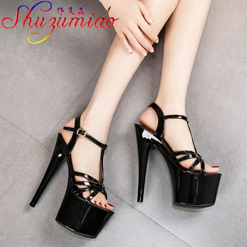 Red patent leather platform heels with thin stiletto and secure cross-belt buckle closure
