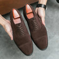 Top-down view of the brown suede oxfords, showcasing the cushioned insole for unmatched comfort.