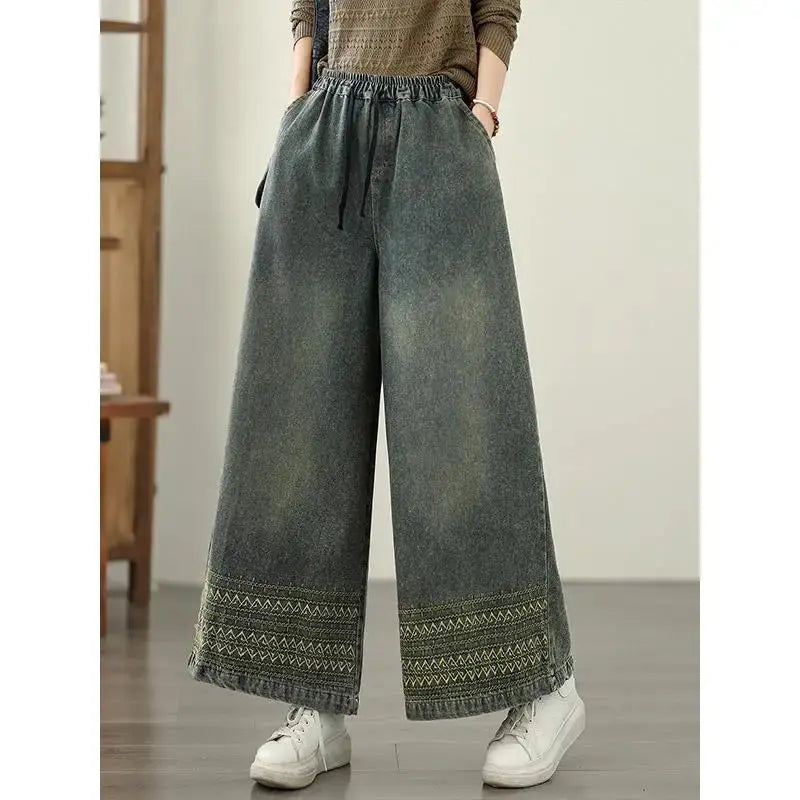 High-waisted Bohemian Rhapsody Denim with intricate ethnic embroidery.