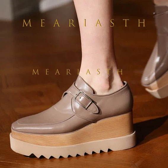 Women's black platform wedge sneakers in leather with rubber traction sole