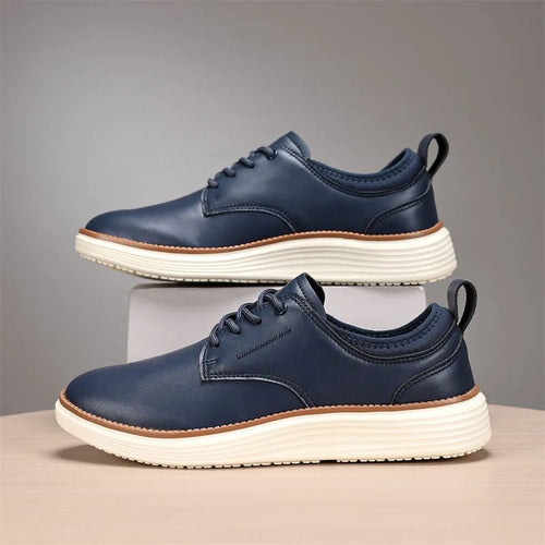 Black leather oxford dress shoes with classic lace-up closure on white background
