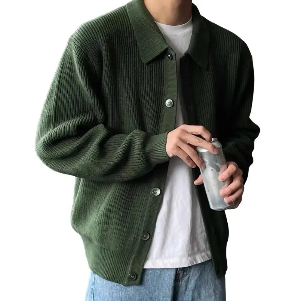 Flat lay of a versatile men's sweater, highlighting its soft yet durable fabric blend.