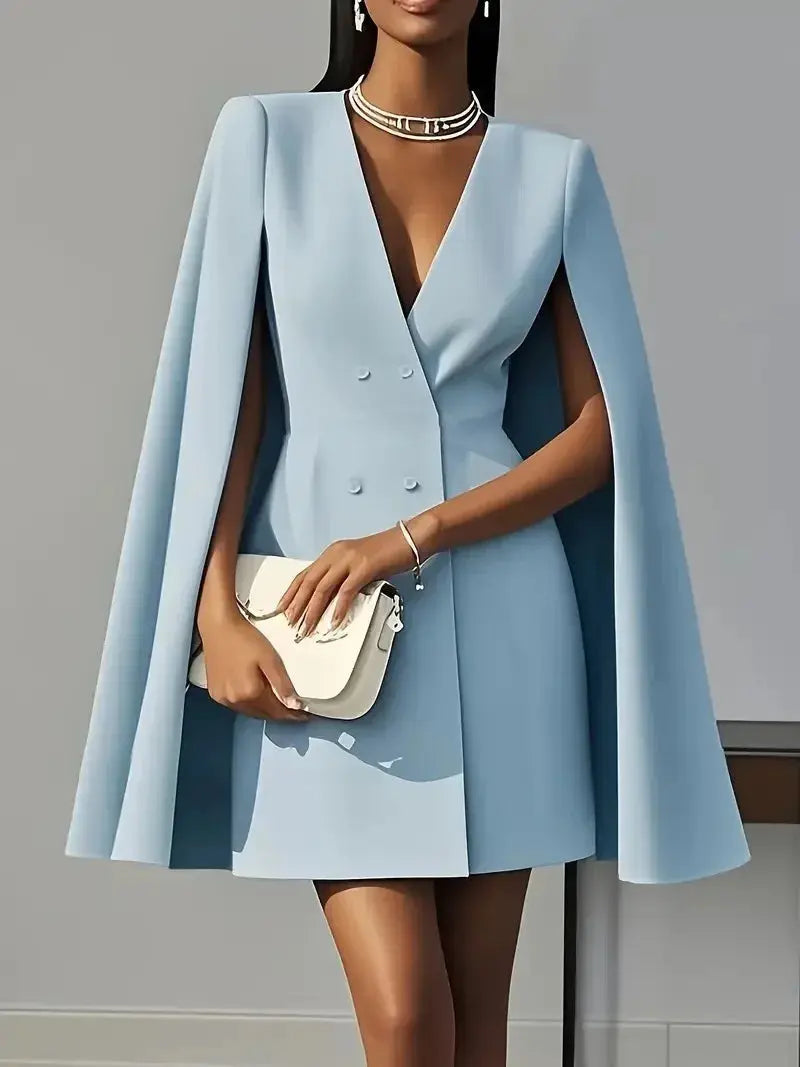Back view of the double-breasted cloak blazer, highlighting its structured silhouette.