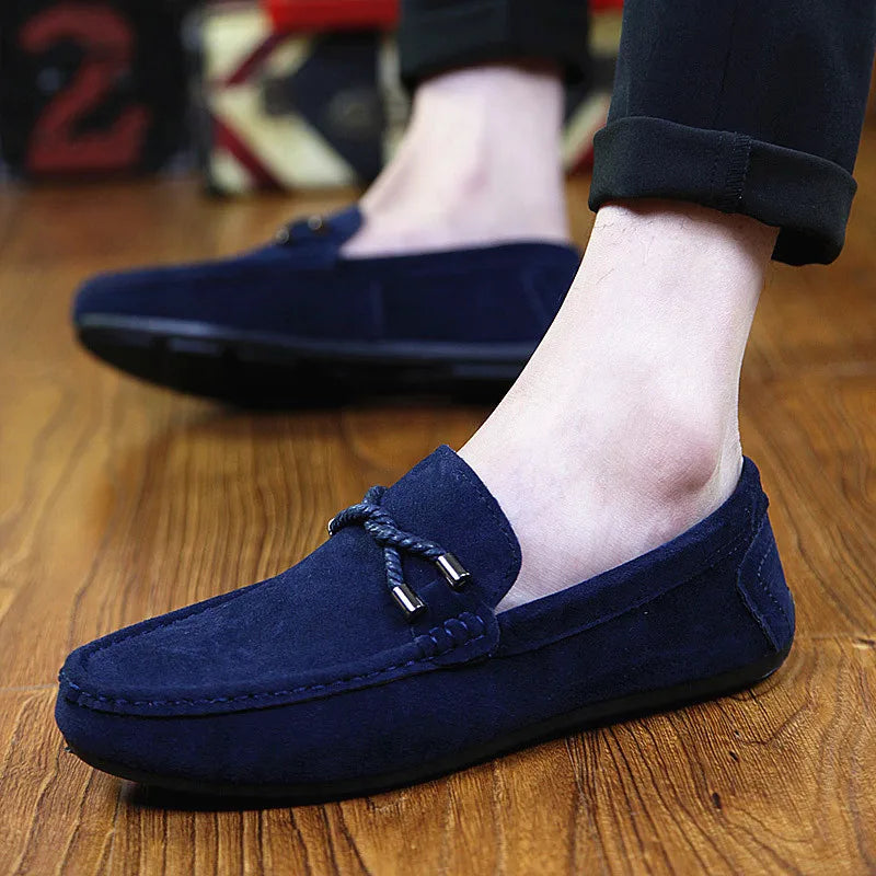 Close-up of breathable grey faux suede loafers with soft rubber sole for cushioned steps.