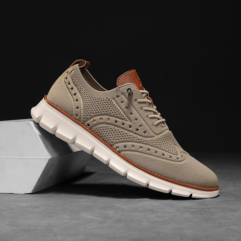 Close-up of breathable mesh wingtip sneakers showing detailed brogue pattern and flexible slip-on design