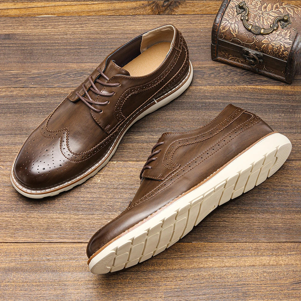 Tan brogue casual shoes with artisan craftsmanship showing detailed stitching and classic wingtip pattern