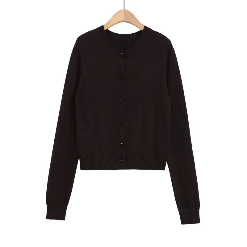 Close-up of the high-stretch fabric of the Autumn Whispers cardigan, emphasizing comfort and style.