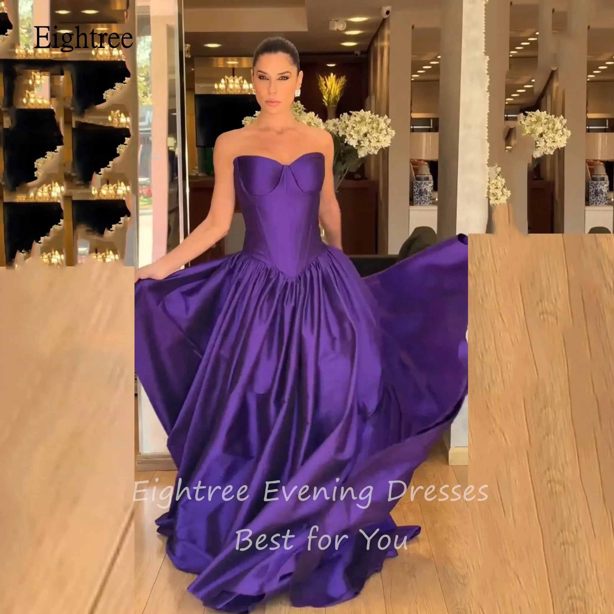 Elegant floor-length purple gown featuring an empire waistline.