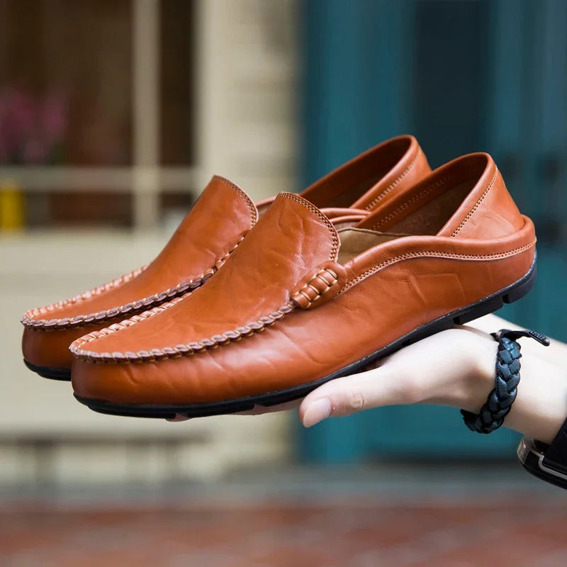 Men's leather loafers paired with casual attire, illustrating versatile fashion essentials.