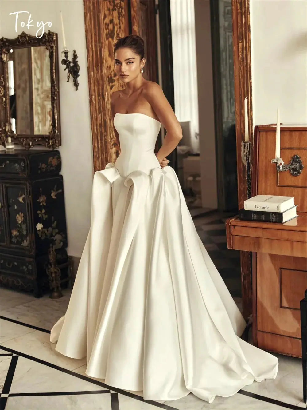 Elegant satin wedding gown with a sweetheart neckline and lace-up back detail.