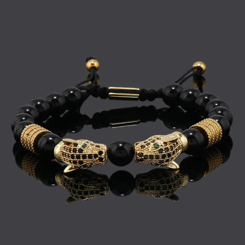 Leopard charm beaded bracelet with 18K gold-plated copper leopard and adjustable lace-up clasp.