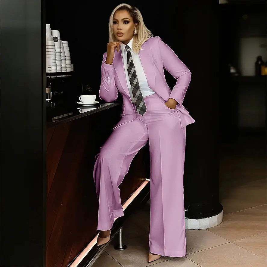 Woman confidently entering a boardroom in a white suit set.