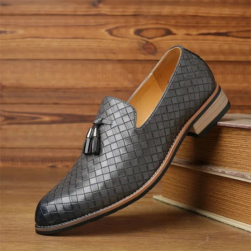Sleek black leather loafers with slip-on design for effortless elegance.