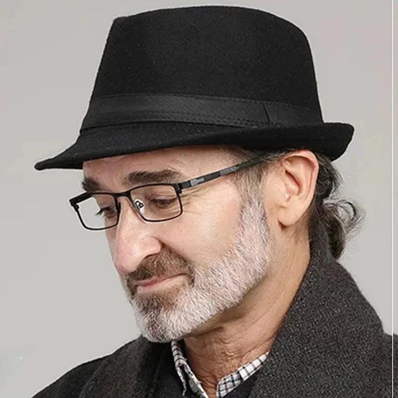 Model wearing Charcoal Whispers Fedora, exuding confidence and style in a casual setting.