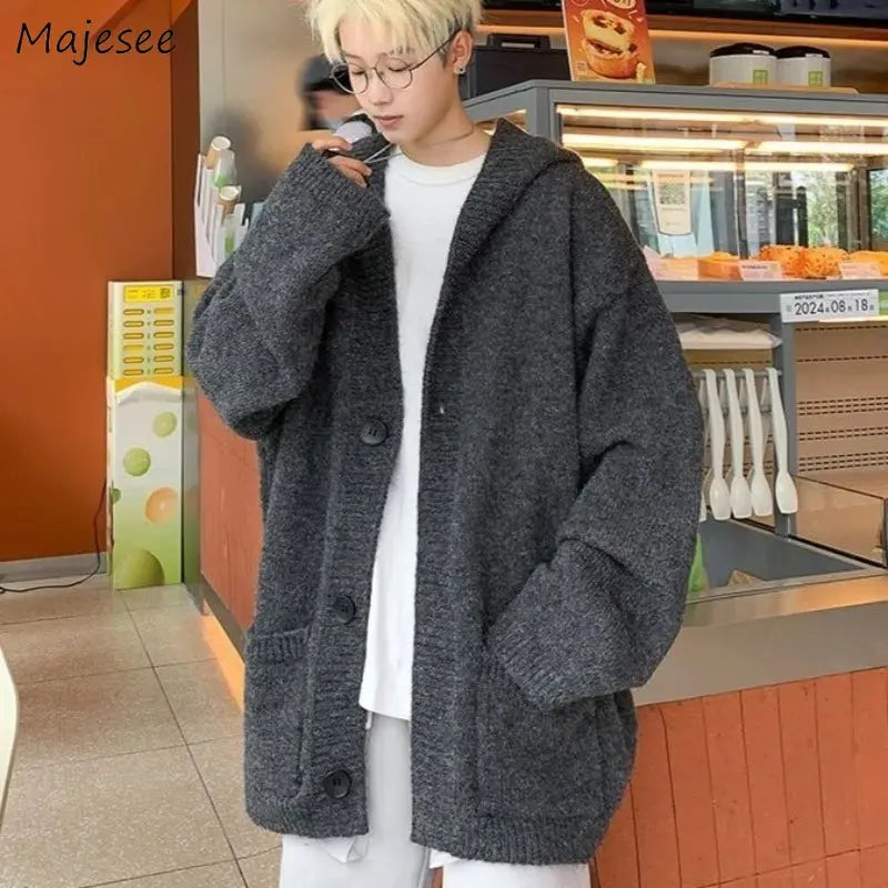 Cozy gray hooded cardigan made of soft cotton and durable polyester for cool days.