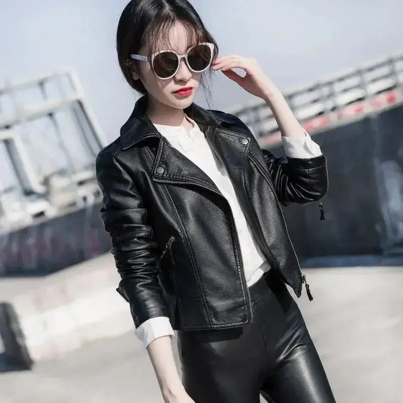 Leather jacket displayed on a hanger, illustrating its versatile fashion for both casual and formal outings.