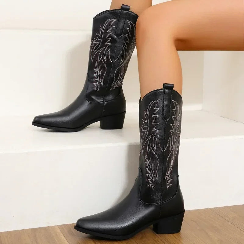 Brown embroidered cowgirl boots with zip-front closure and waterproof construction