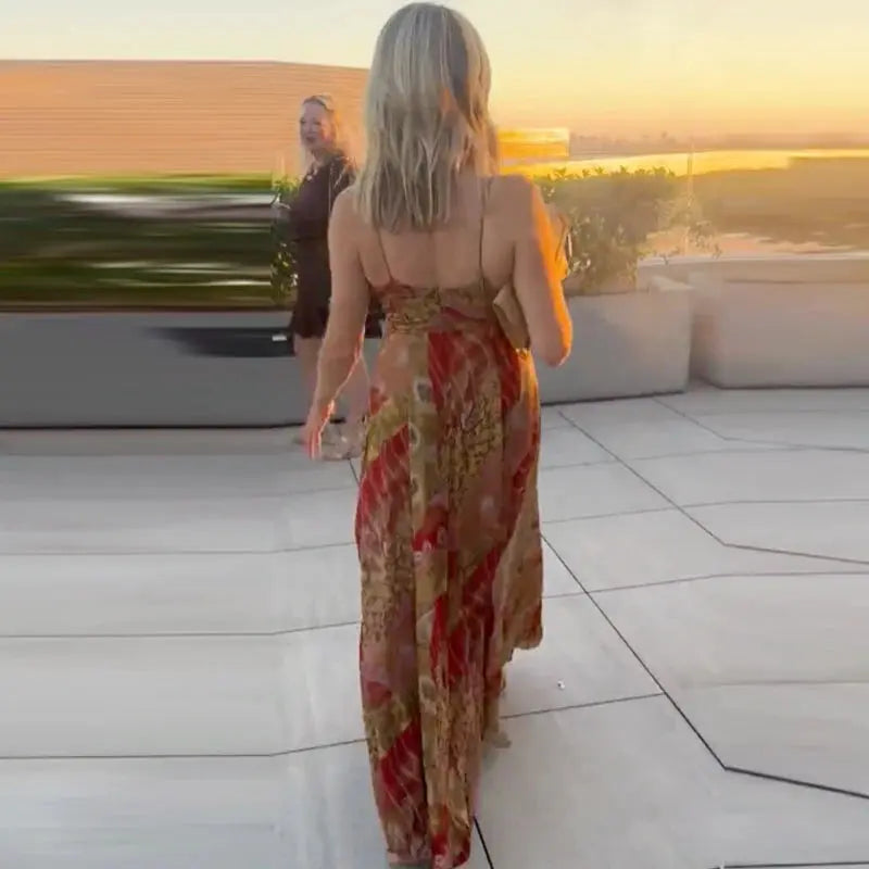 Model wearing the Summer Breeze Midi Dress at a garden party, highlighting its elegant summer wear.