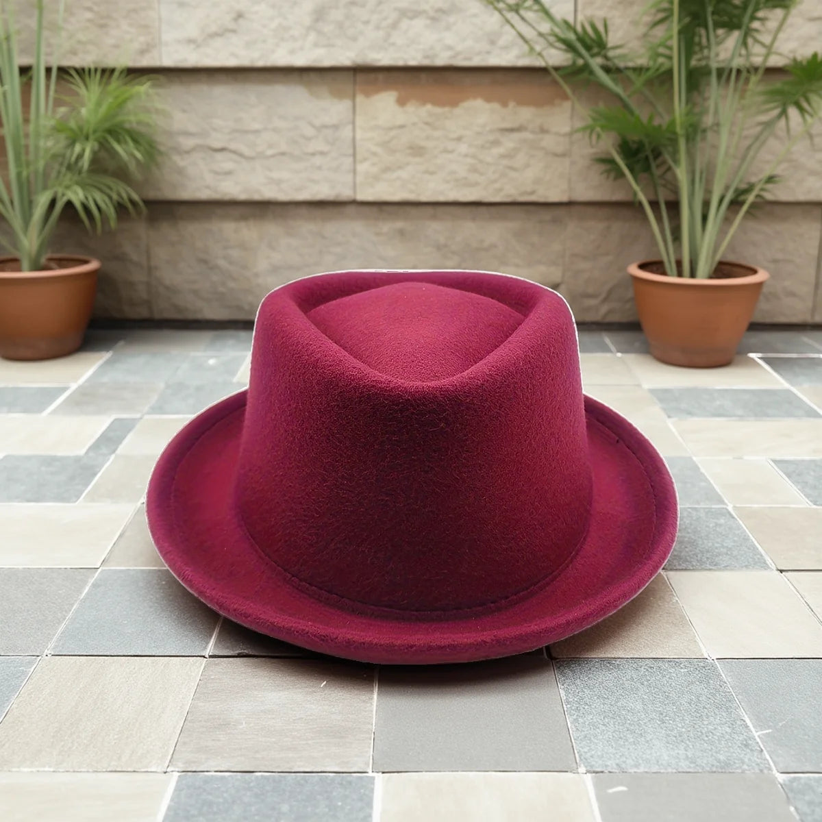 Versatile black fedora, a statement hat that commands attention in any urban setting or gathering.