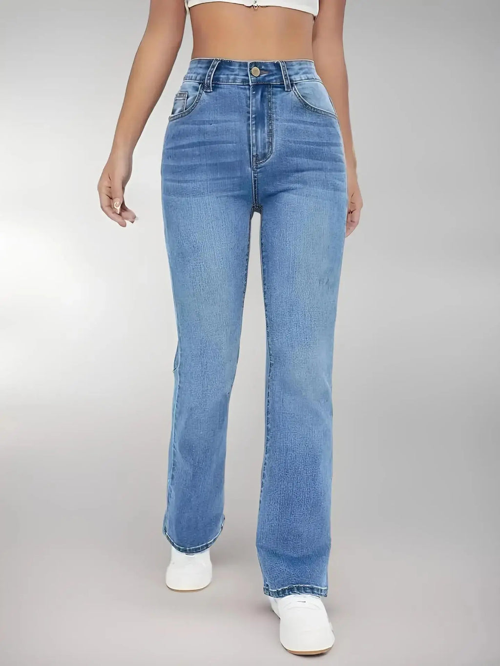 Full-length view of high-waist jeans, perfect for casual chic outfits from day to evening.
