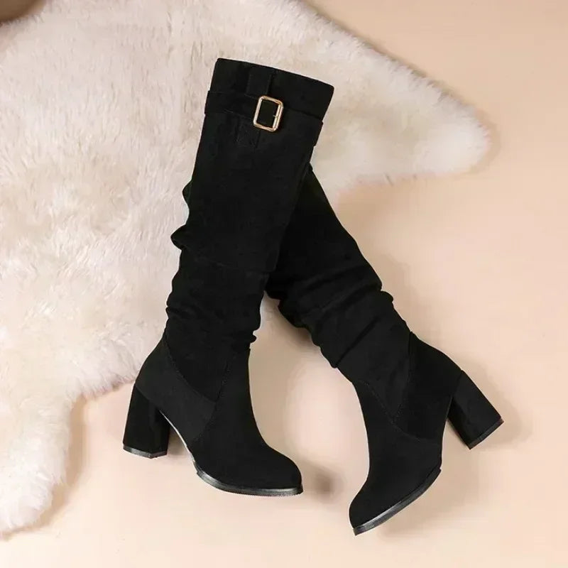 Classic waterproof suede boots featuring lined construction and stable square heel
