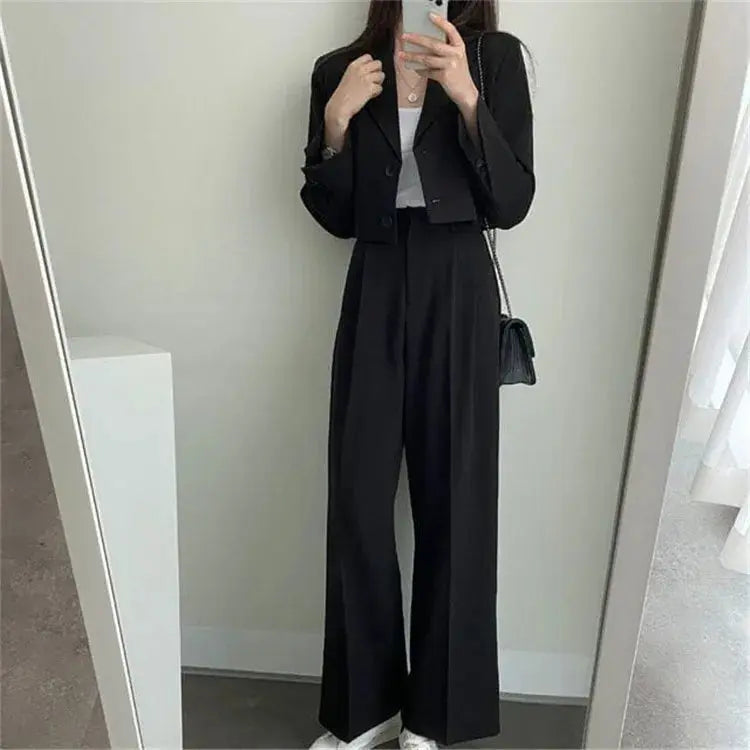 Side view of the model in the power suit, demonstrating seamless movement and fit.