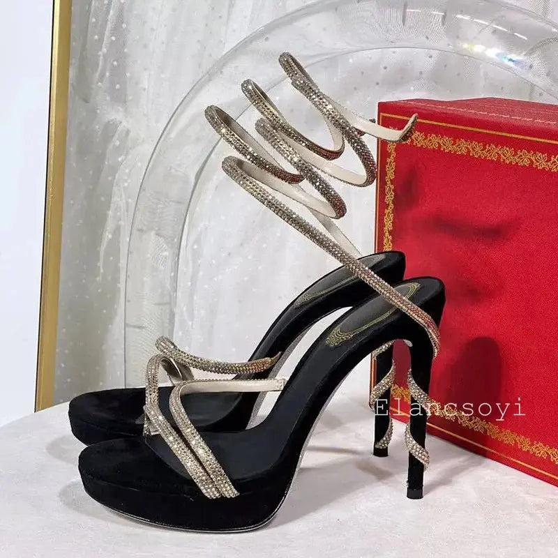 Close-up of shimmering crystals on elegant stiletto heels.