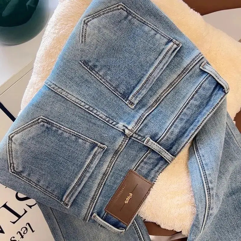 Close-up of soft velvet lining in stylish flared jeans, ideal for cozy winter outfits.