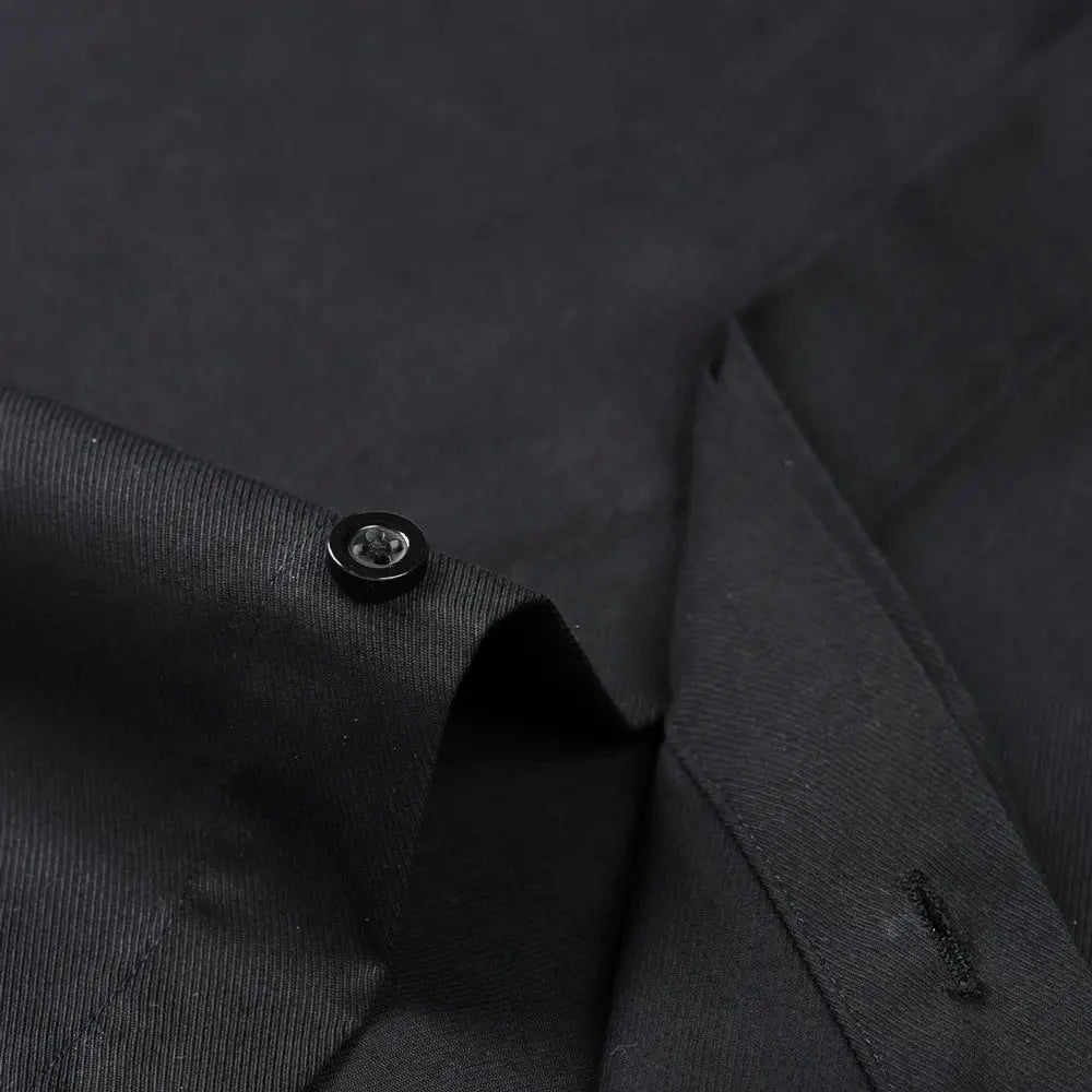 Elegant French cuffs showcasing unique cufflink options on a white shirt.