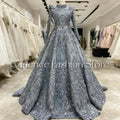 Luxurious lace gown with hand-beaded high neckline and full sleeves in elegant floor-length design.