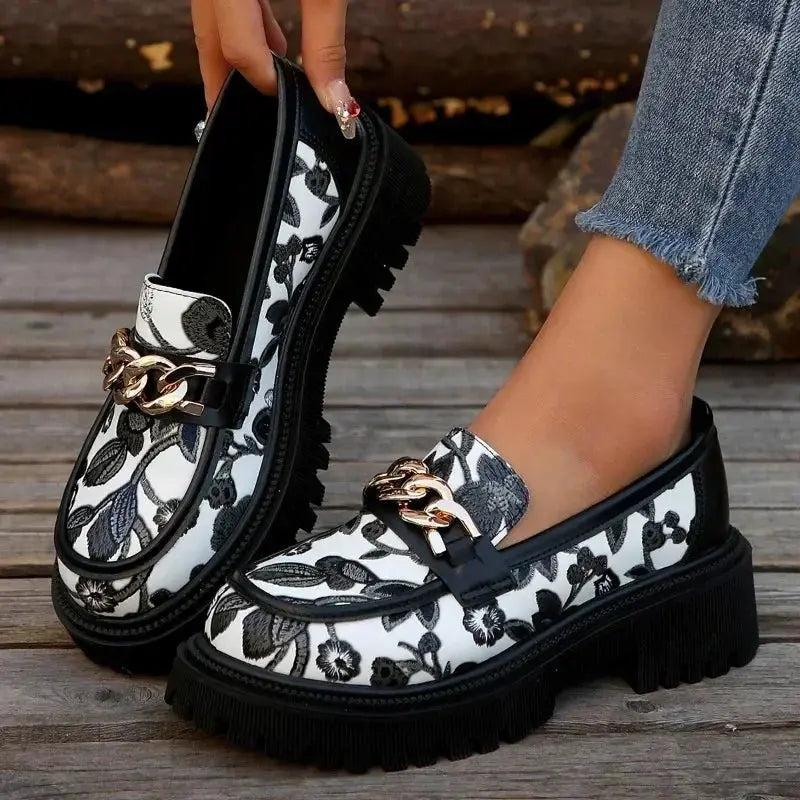 Close-up of handcrafted metal decoration on Chic Rendezvous Pumps, showcasing luxury.