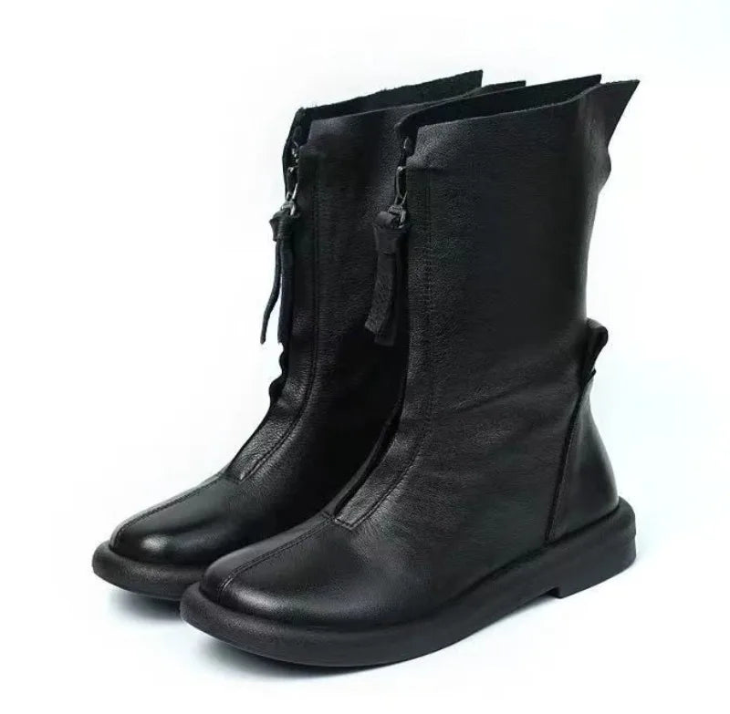 Brown leather boots with zip closure and durable rubber traction outsole