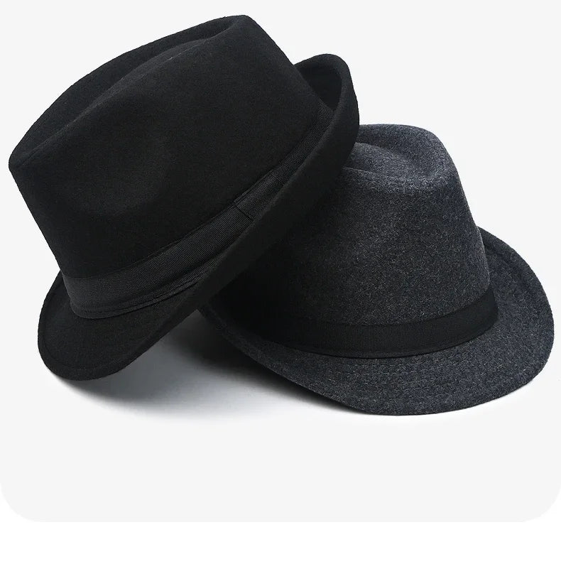 Charcoal fedora displayed on a wooden table, highlighting its versatile style.