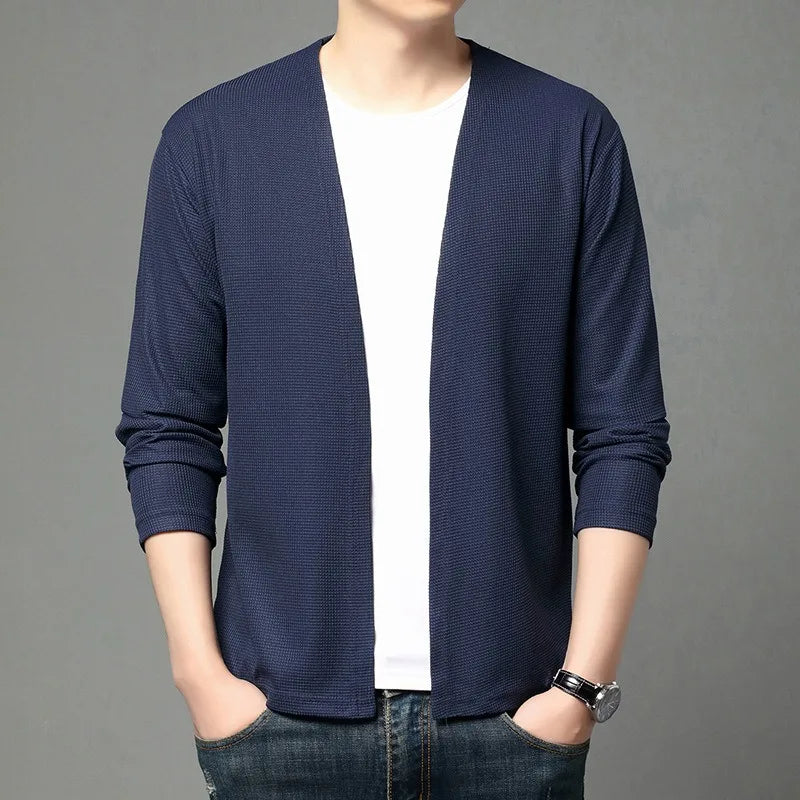 Flat lay of the cardigan with winter accessories, showcasing its stylish appeal.