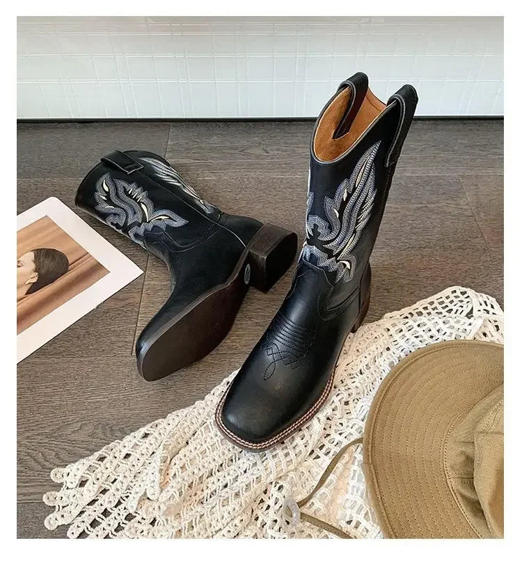 Brown embroidered cowboy boots with slip-on design and durable leather construction