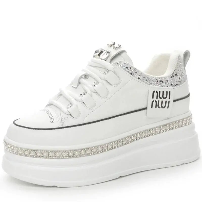 Black leather sneakers with hidden heel for a subtle height boost.