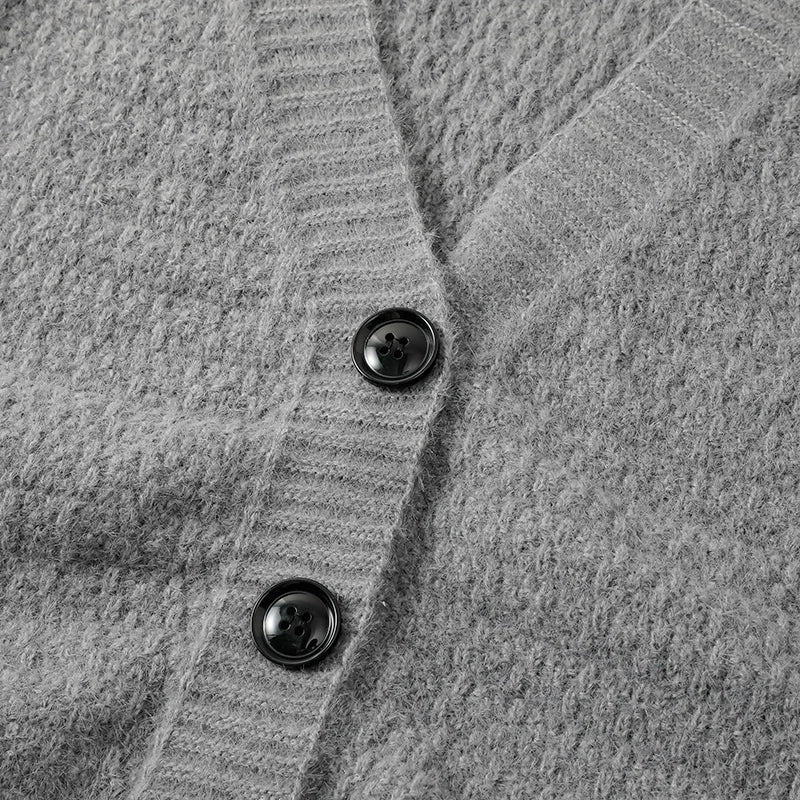Close-up of the luxurious knit pattern on the Autumn Whisper cardigan, showcasing its durability.